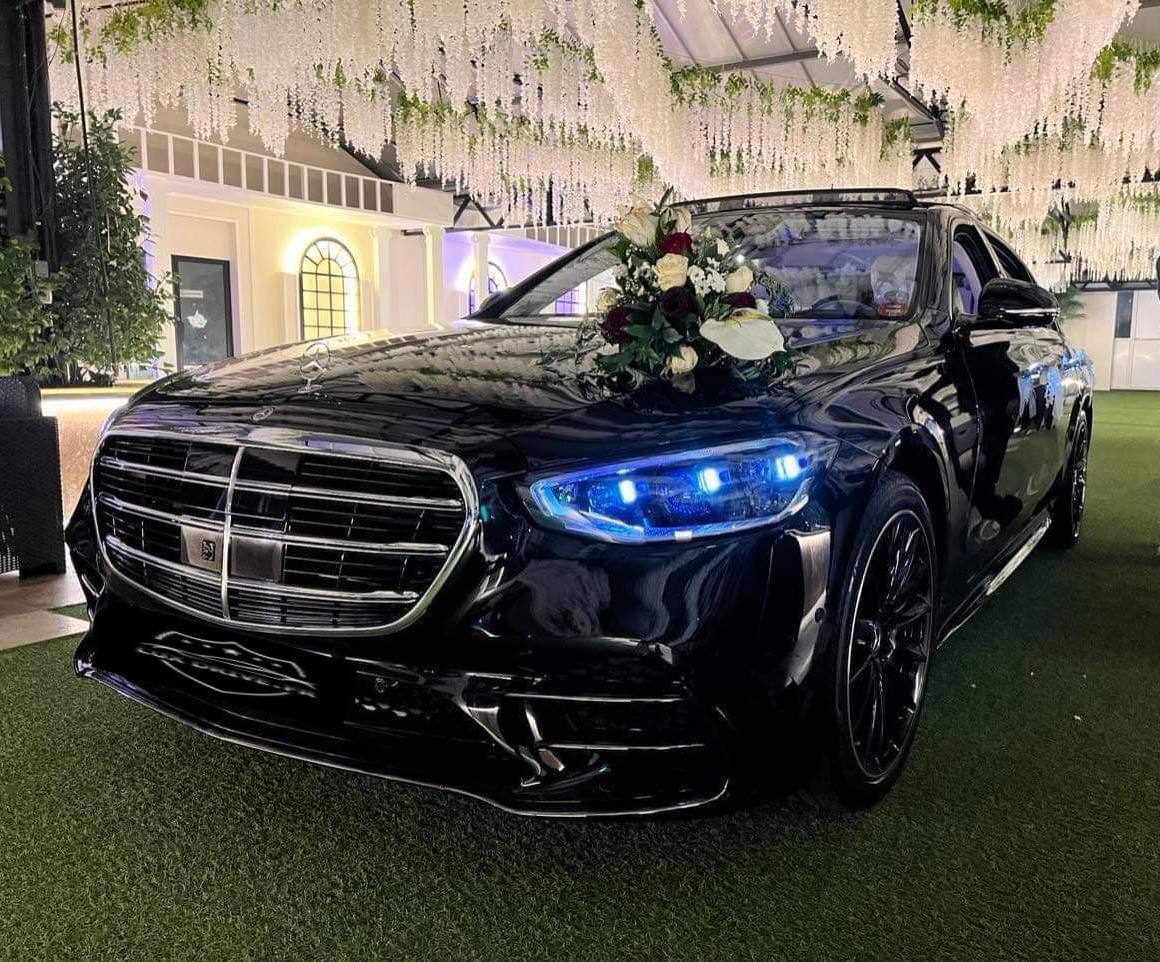 Technician correcting paintwork on a performance coupe